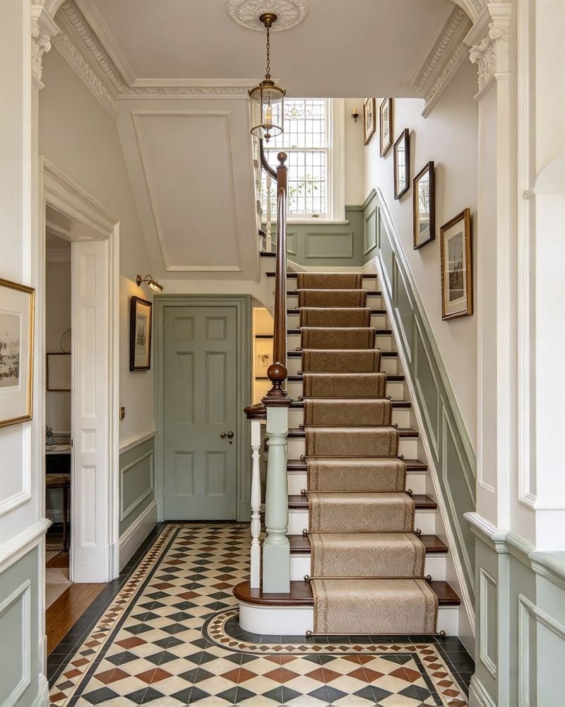 Illustration: a Victorian hallway with an encaustic tiled floor and painted staircase.