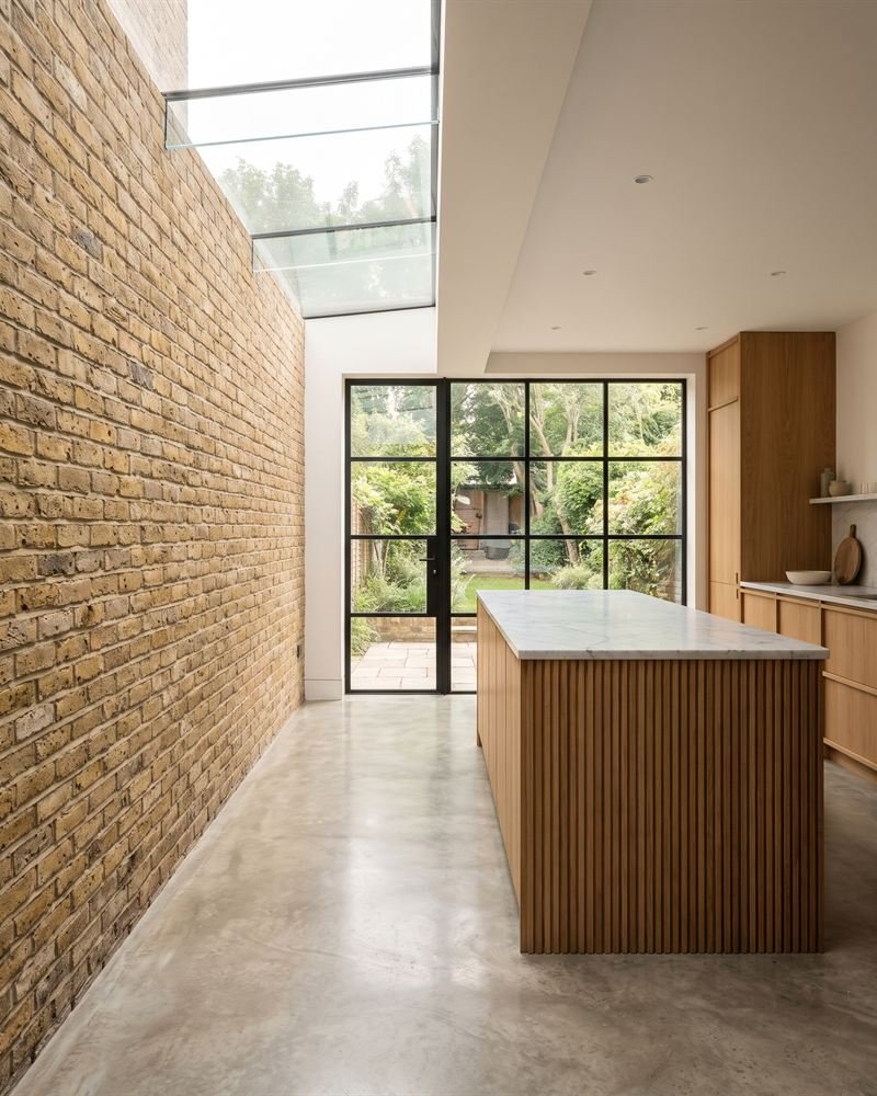 Illustration: a side return kitchen extension with an exposed brick wall and rooflight.
