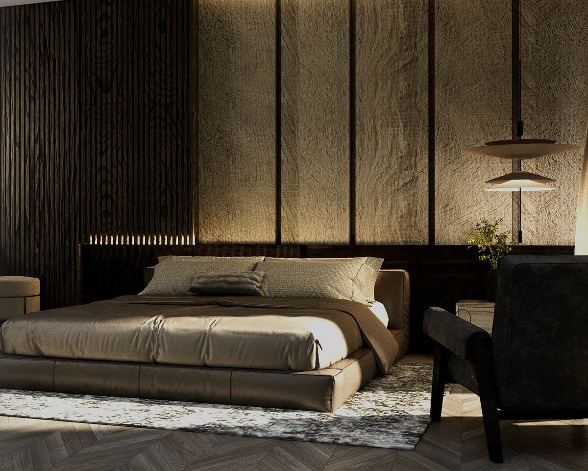 A bedroom interior designed by BIM Performance, with a timber slatted wall, warm lighting and a low upholstered bed.